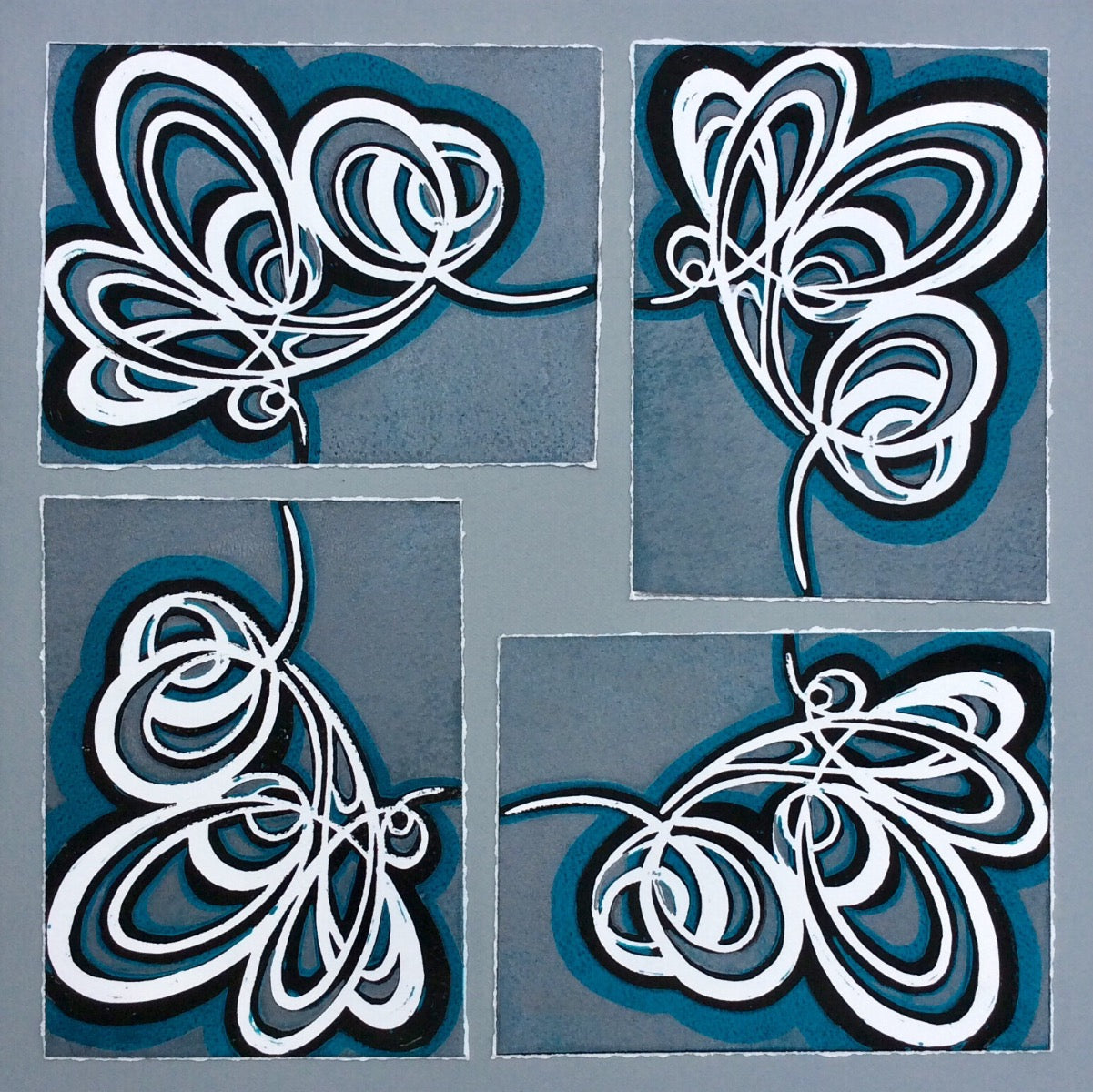 Green, black and white contemporary botanical wall on a grey back ground. Part one of a trio on canvases.