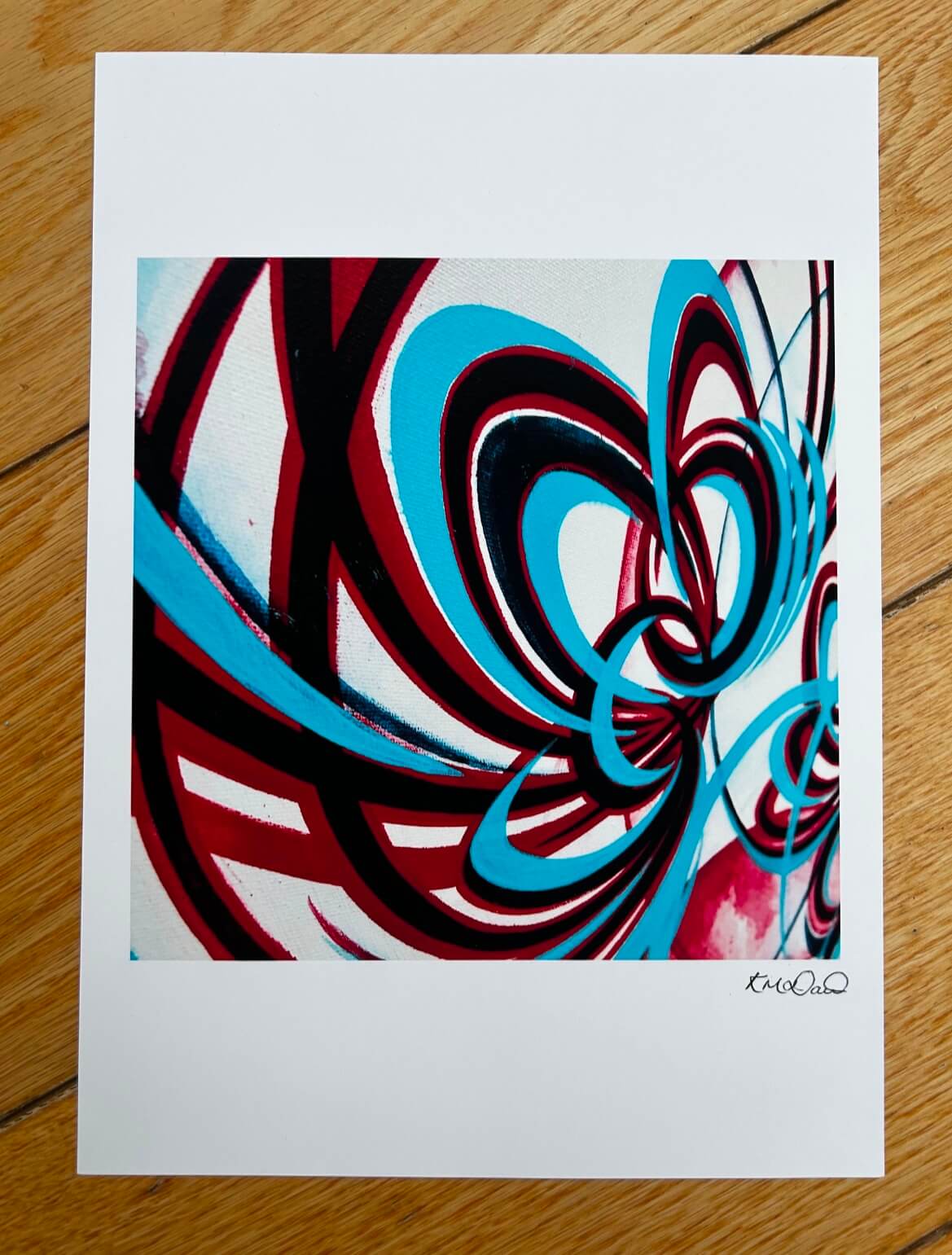 Turquoise, red and navy floral prints signed by the artist.