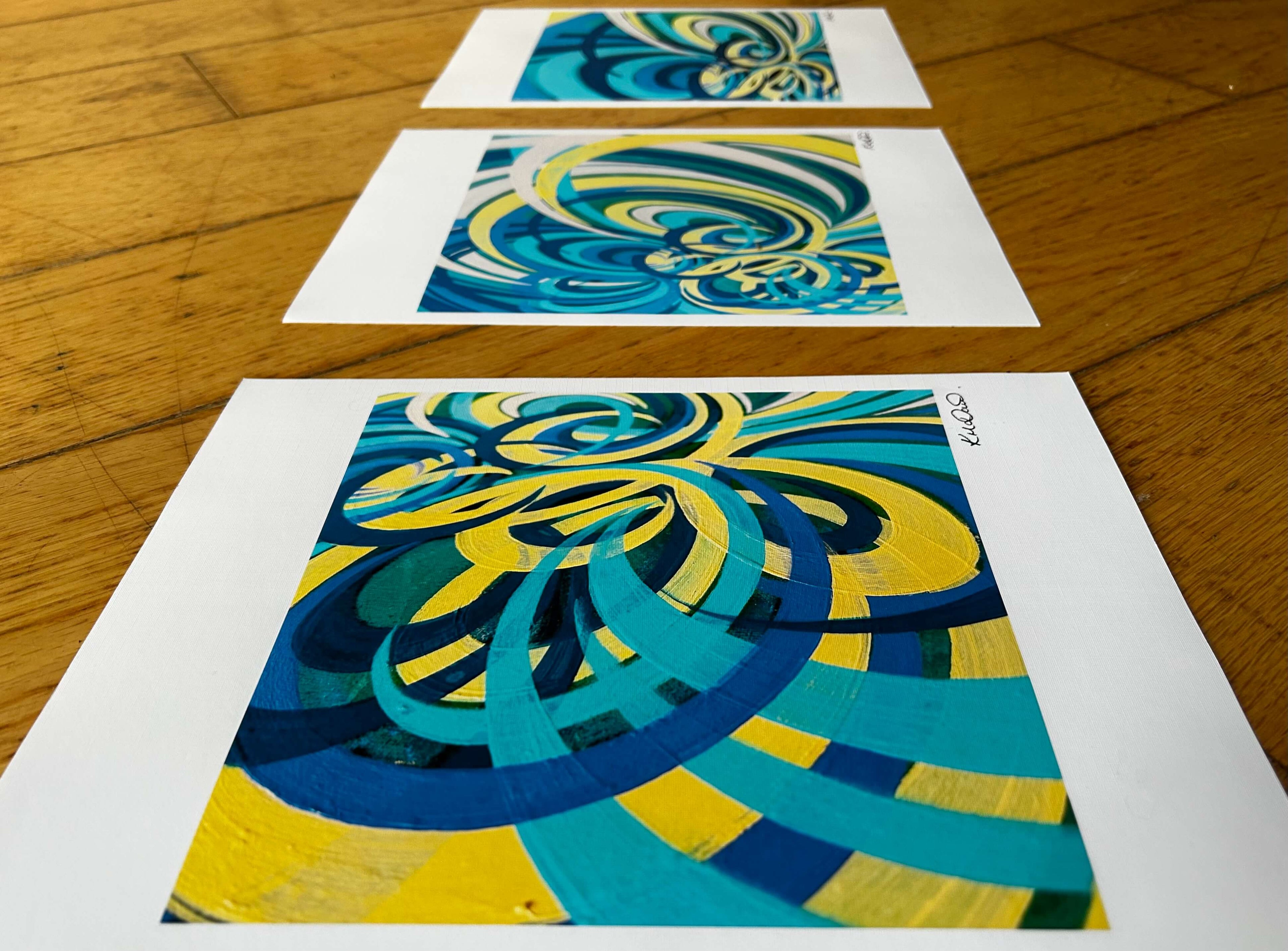 Set of three yellow, turquoise and blue colourful prints.