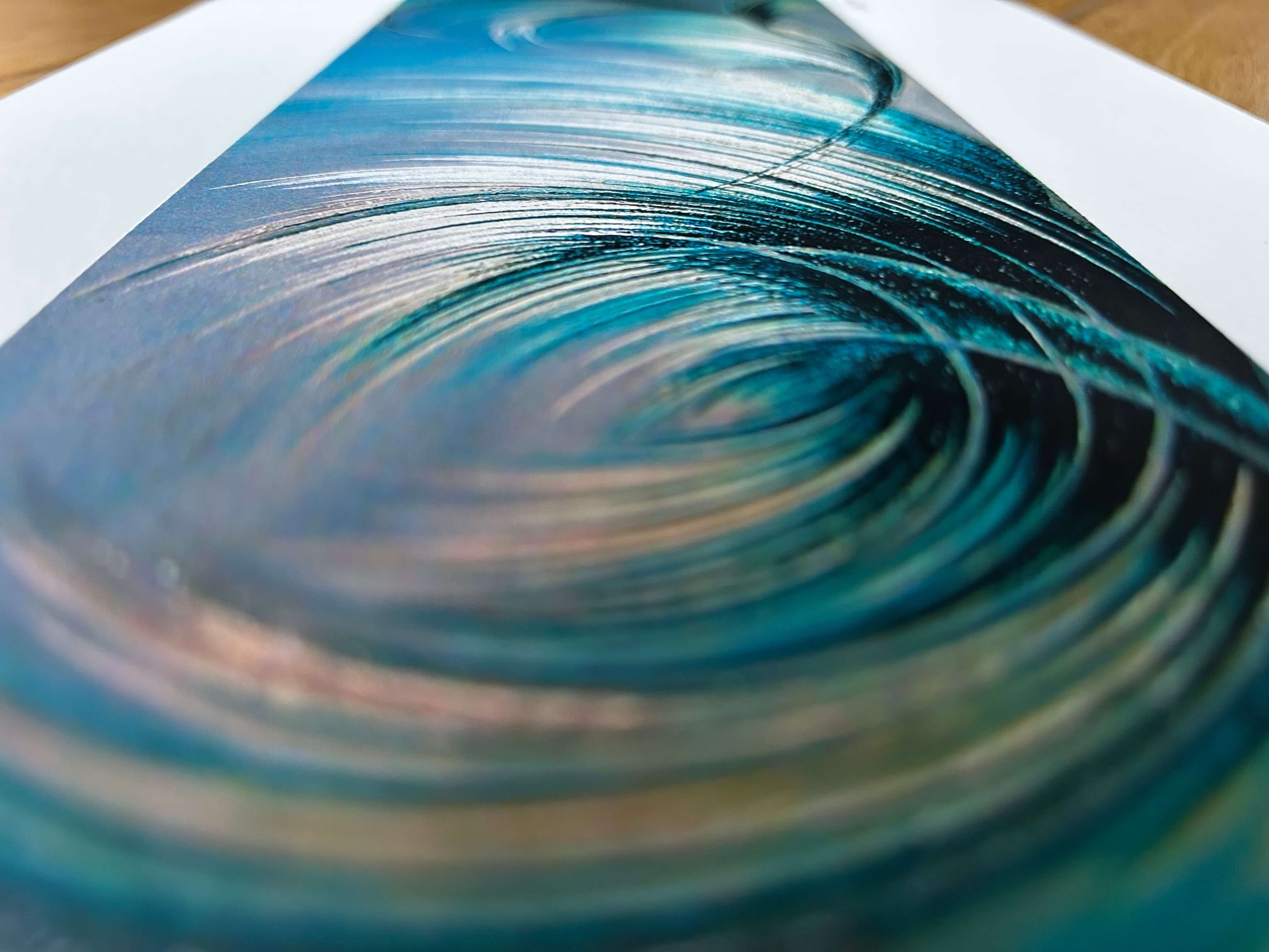 Blue abstract artwork on paper with delicate gold and silver highlights.