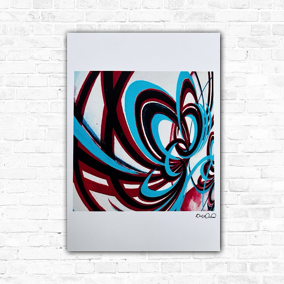 Flower prints signed by an artist, with predominantly red and turquoise colors, displayed against a white brick wall background.