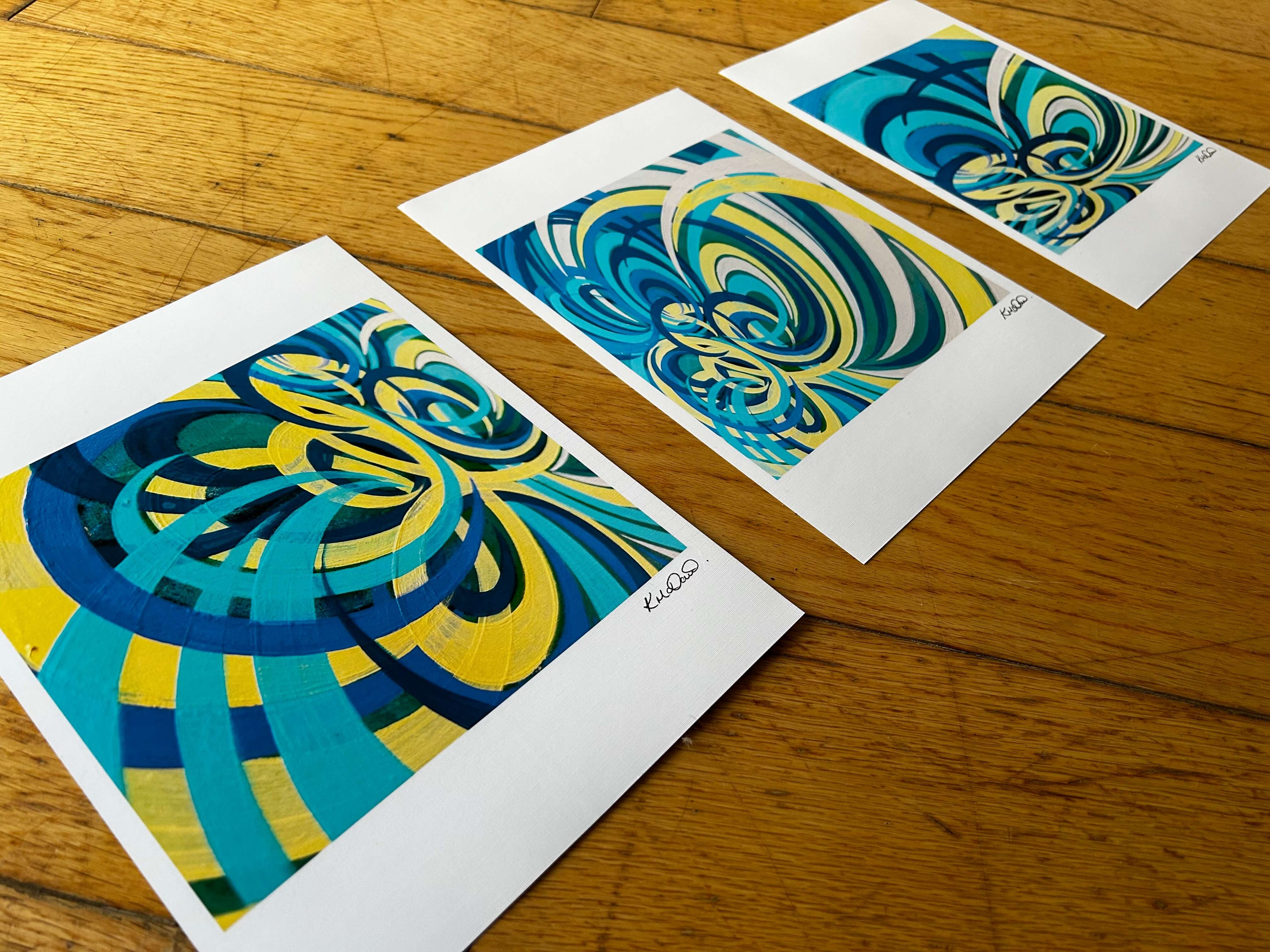 Three yellow, turquoise and blue triptych art.