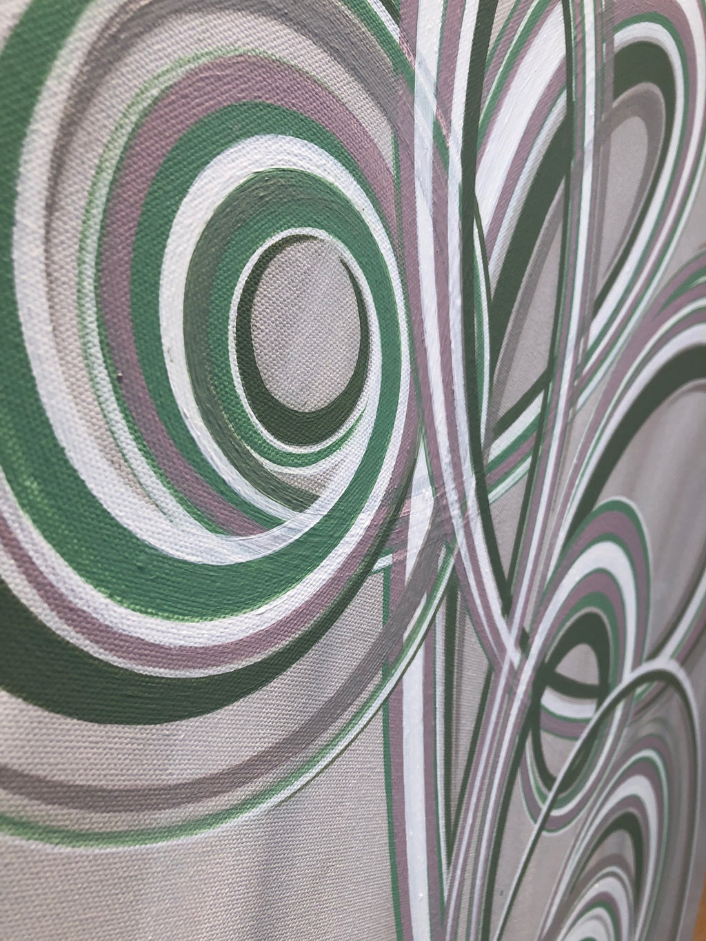Pastel toned swirls on an modern canvas painting.