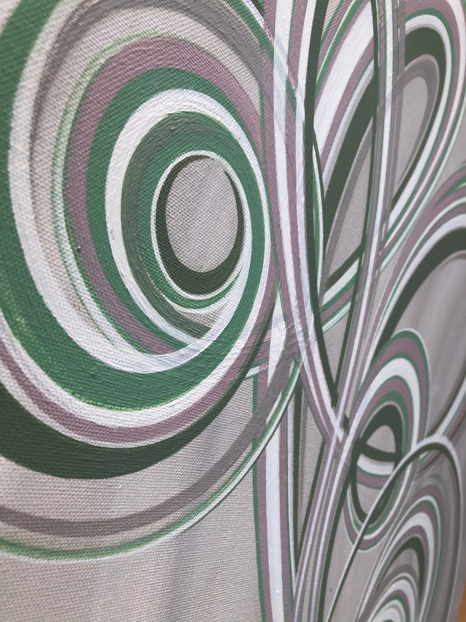 Pastel toned swirls on an modern canvas painting.
