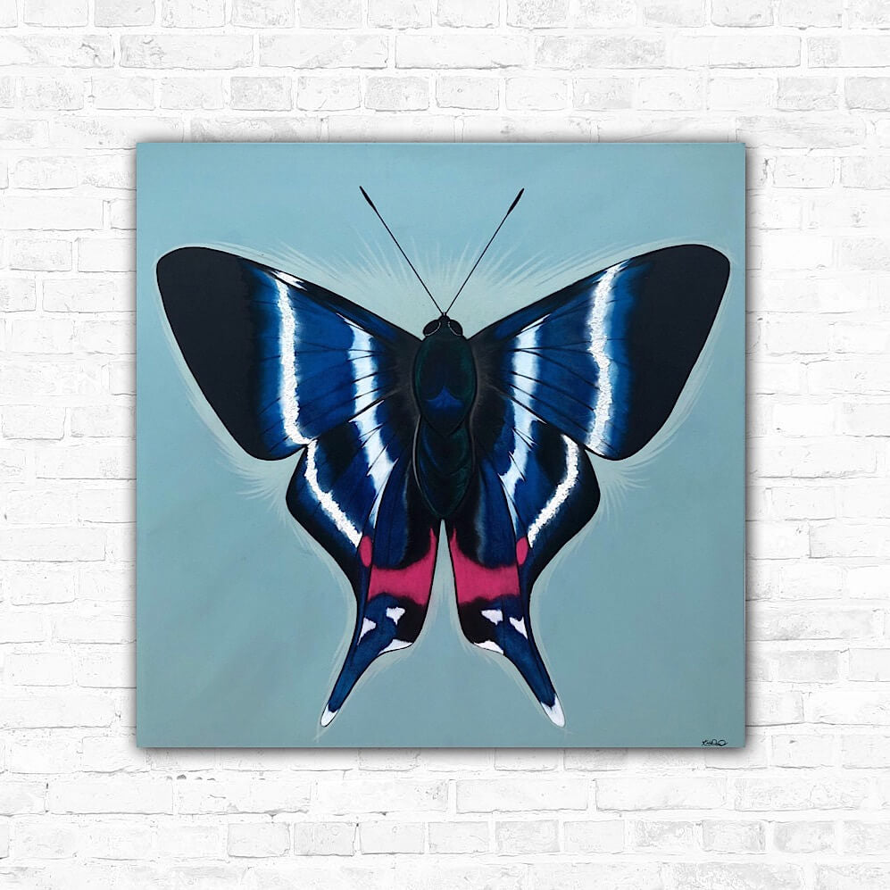 A butterfly canvas with a vibrant colour palette featuring vivid blues, black, silver, subtle green highlights, and a splash of fuchsia on a fresh aqua blue background.