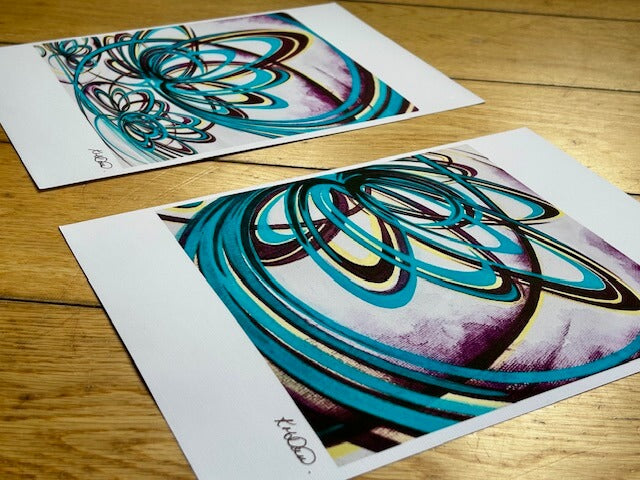 Pair of turquoise, maroon and yellow abstract art prints.