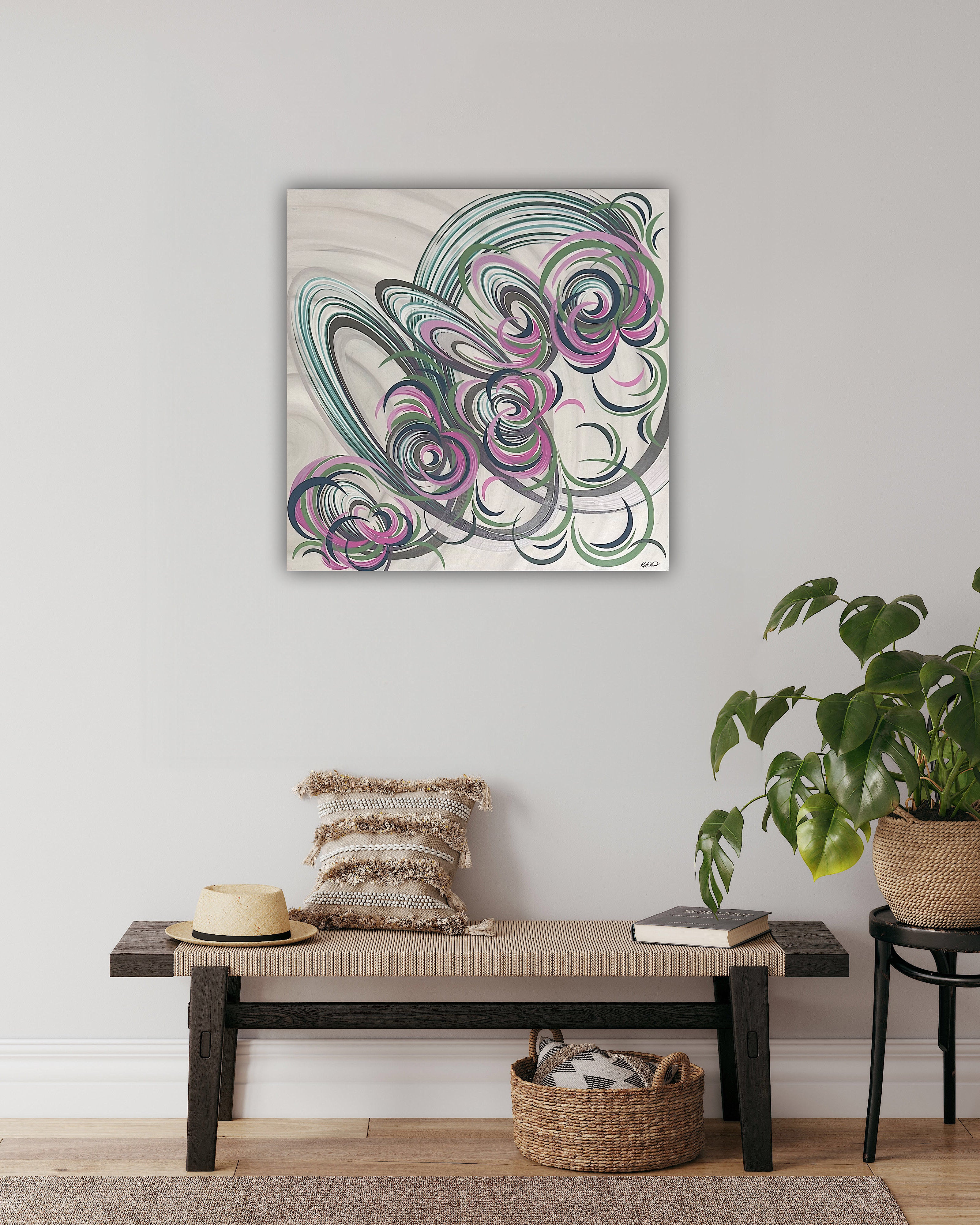 A floral abstract painting with a pink, blue, green and cream colour palette, hung on the wall in a hallway scene.