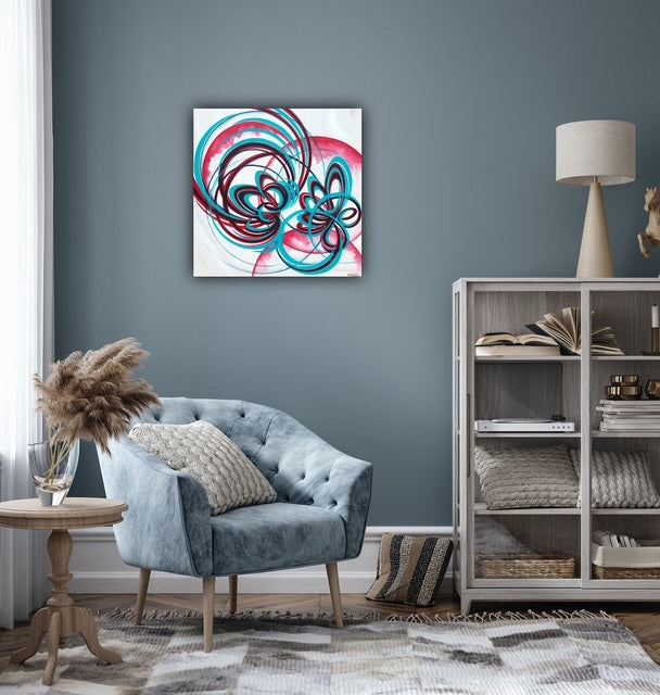 Red, navy and turquoise canvas art about flowers.